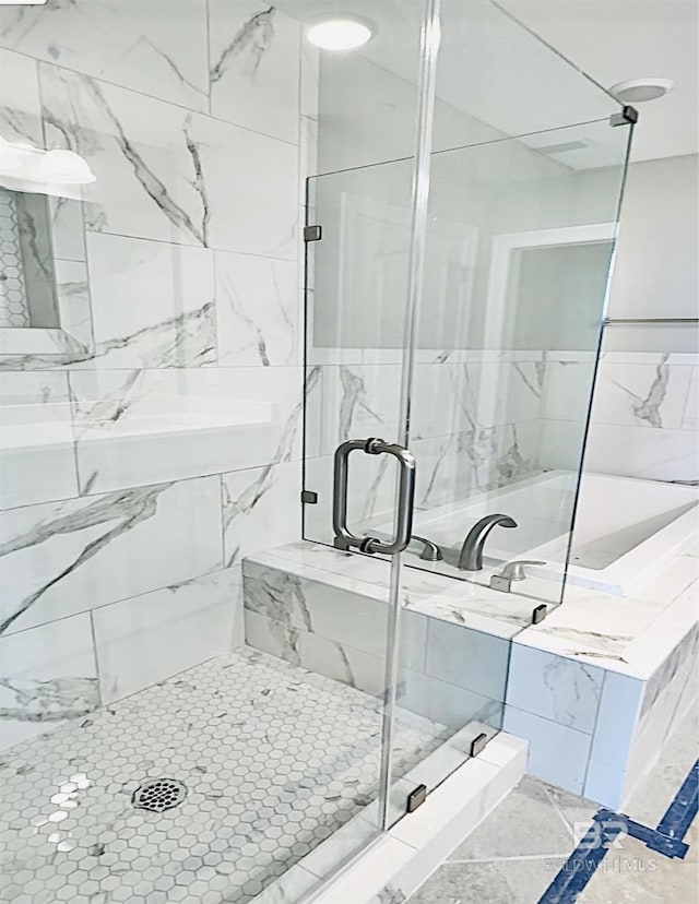 bathroom with a shower with shower door