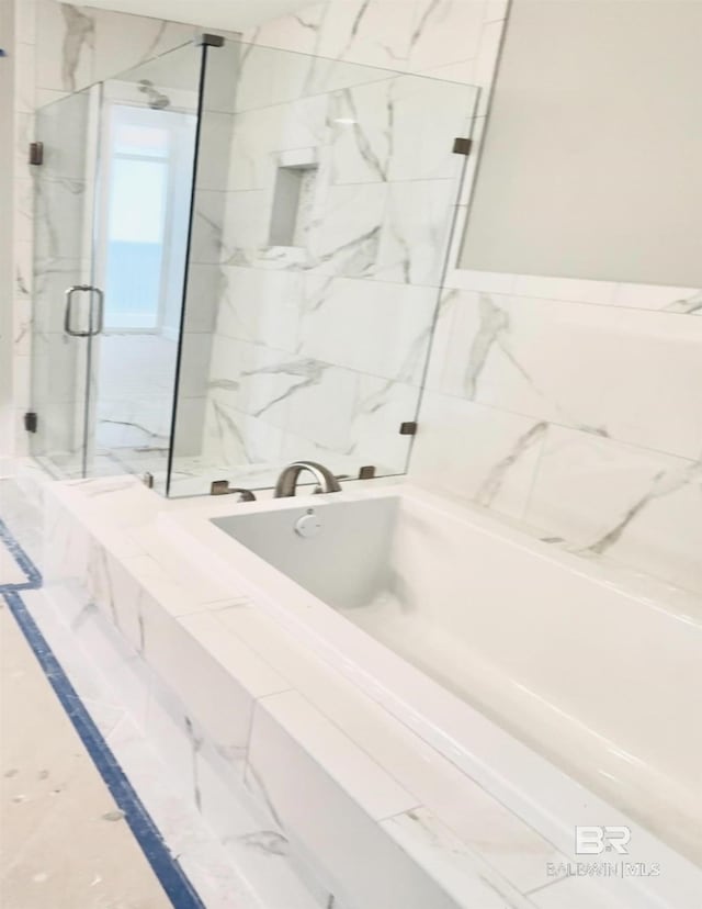 bathroom with separate shower and tub