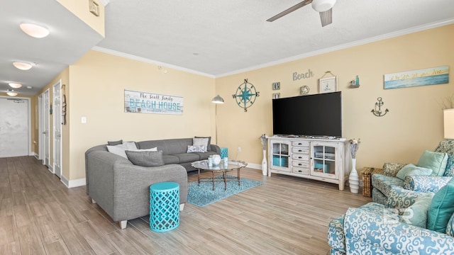 1524 W Beach Blvd Unit 603, Gulf Shores, AL 36542 - living room featuring light wood finished floors, ceiling fan, ornamental molding, baseboards, and a textured ceiling