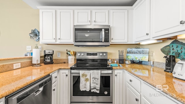 1524 W Beach Blvd Unit 603, Gulf Shores, AL 36542 - kitchen with stainless steel appliances and white cabinets