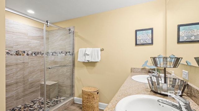 1524 W Beach Blvd Unit 603, Gulf Shores, AL 36542 - full bathroom with a stall shower, double vanity, baseboards, and recessed lighting