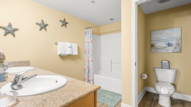 1524 W Beach Blvd Unit 603, Gulf Shores, AL 36542 - full bath with toilet, wood finished floors, shower / tub combo, and vanity