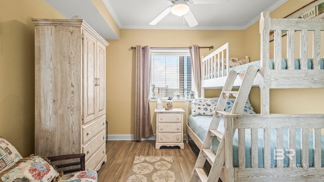 1524 W Beach Blvd Unit 603, Gulf Shores, AL 36542 - bedroom with wood finished floors, crown molding, baseboards, and ceiling fan