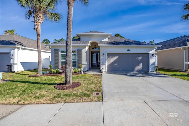 view of front of house featuring a front lawn and a garage