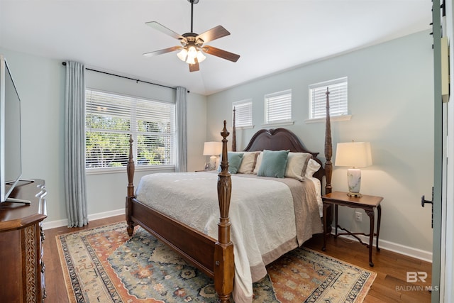 bedroom with wood-type flooring and ceiling fan