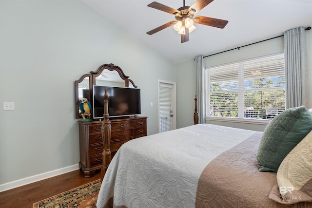 bedroom with a closet, dark hardwood / wood-style floors, ceiling fan, and lofted ceiling