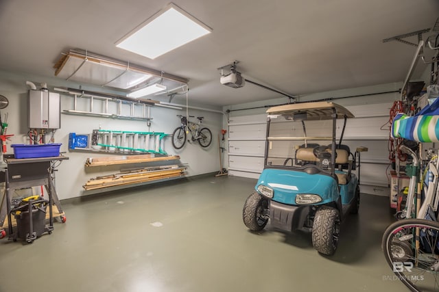garage featuring tankless water heater and a garage door opener