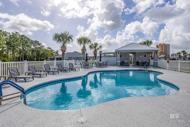 view of swimming pool featuring a patio