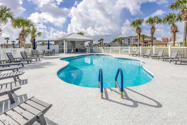 view of swimming pool featuring a patio area