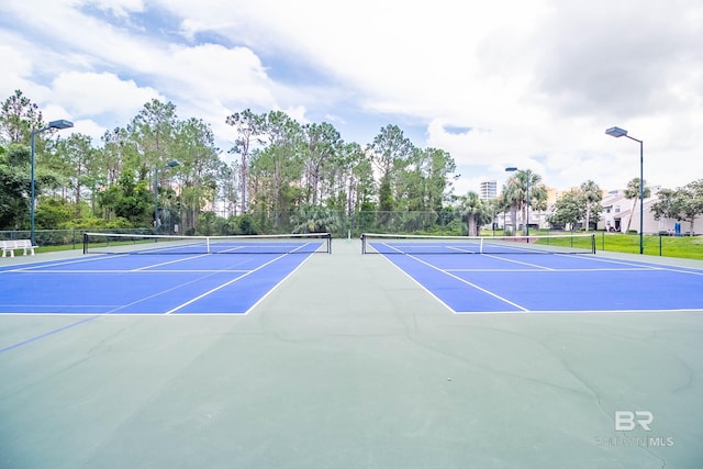 view of sport court with basketball hoop