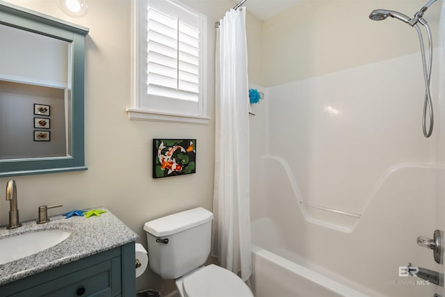 full bathroom with vanity, shower / tub combo, and toilet