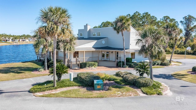 view of front of property featuring a water view and a porch
