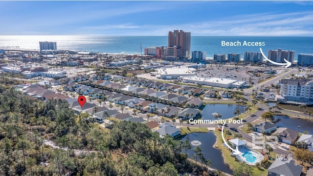 birds eye view of property featuring a water view