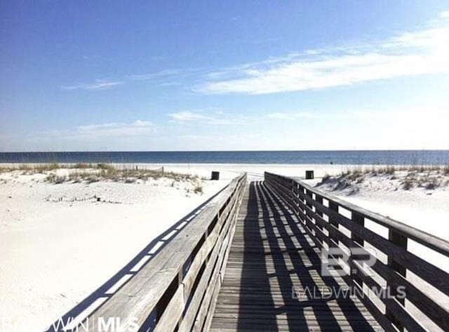 view of property's community with a view of the beach and a water view