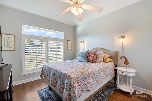 bedroom with ceiling fan and dark wood-type flooring