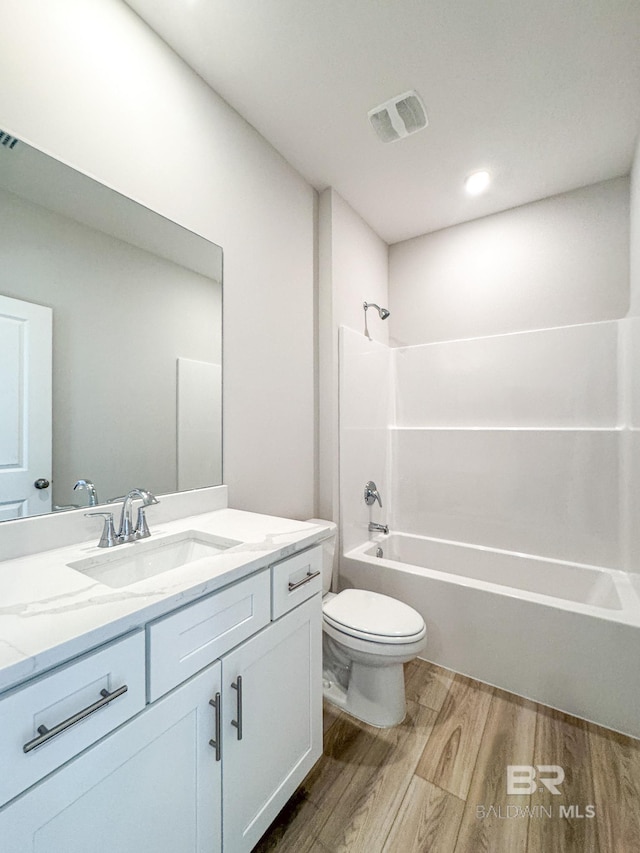 23850 Shadowridge Dr, Daphne, AL 36526 - full bathroom with wood finished floors, toilet, vanity, and bathing tub / shower combination