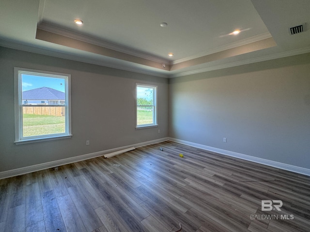 23850 Shadowridge Dr, Daphne, AL 36526 - empty room with a tray ceiling, crown molding, dark wood-type flooring, baseboards, and recessed lighting