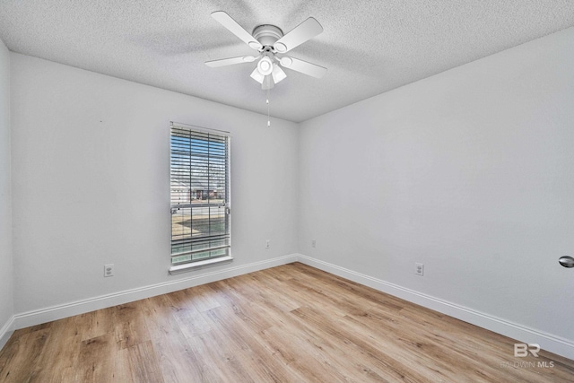 spare room featuring a textured ceiling, light hardwood / wood-style flooring, and ceiling fan