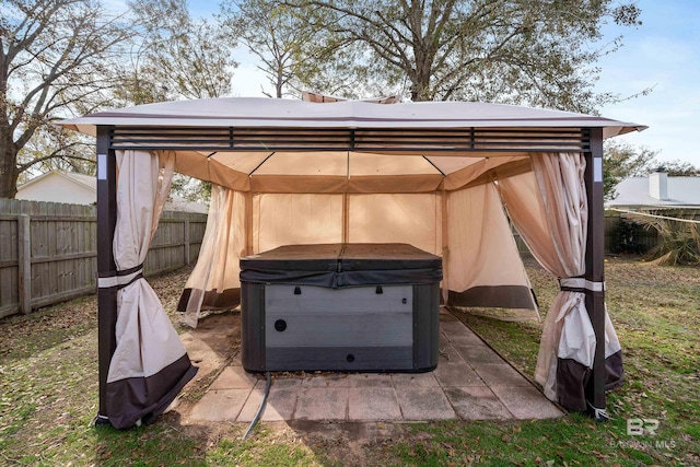 view of outdoor structure featuring a gazebo and a hot tub