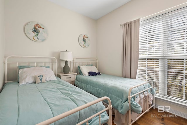 bedroom featuring wood finished floors