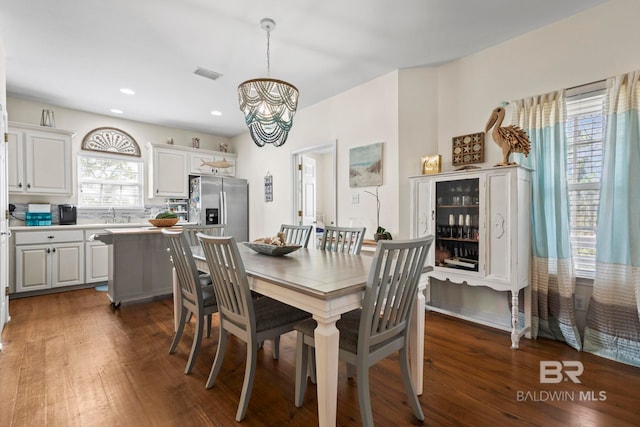 dining room featuring visible vents, a chandelier, dark wood-type flooring, and recessed lighting