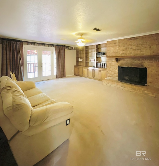 living room featuring visible vents, light carpet, french doors, a textured ceiling, and a brick fireplace