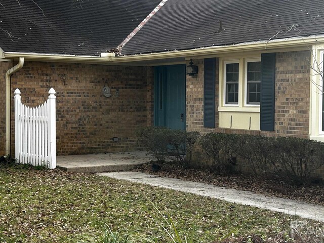 ranch-style house with a front lawn