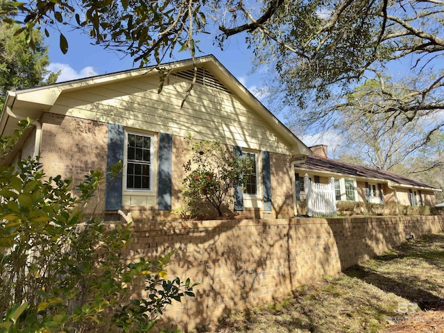 view of home's exterior featuring brick siding