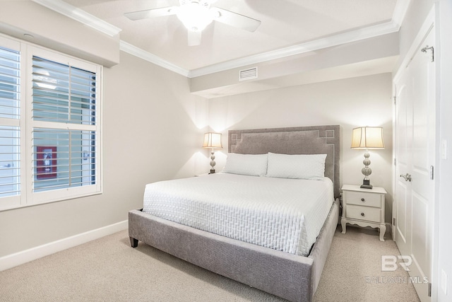 bedroom featuring baseboards, multiple windows, visible vents, and crown molding