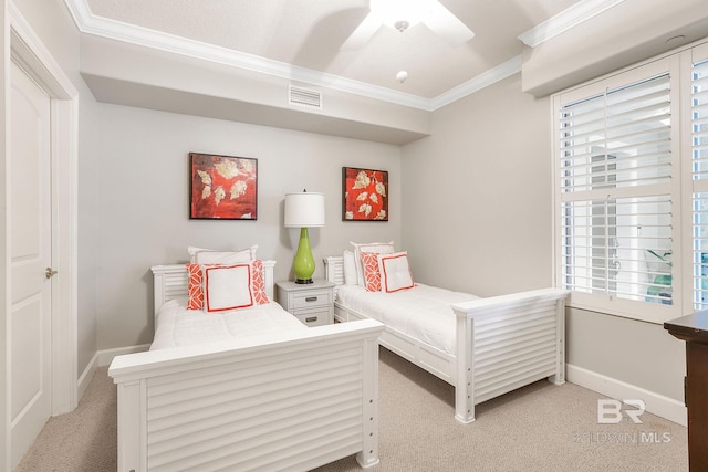 bedroom with baseboards, ornamental molding, visible vents, and light colored carpet