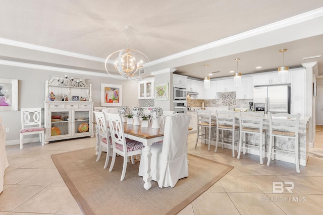 dining room featuring light tile patterned flooring, a raised ceiling, an inviting chandelier, and crown molding