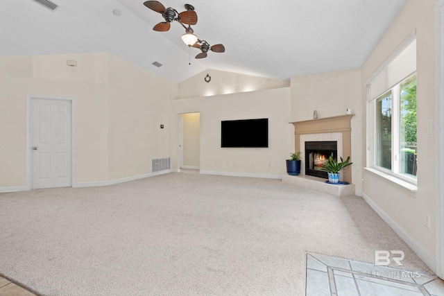 25391 Monarch Ct, Loxley, AL 36551 - unfurnished living room featuring ceiling fan, vaulted ceiling, carpet flooring, a fireplace, and baseboards