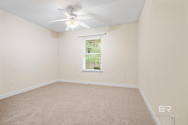 25391 Monarch Ct, Loxley, AL 36551 - spare room featuring light carpet, a ceiling fan, a textured ceiling, and baseboards