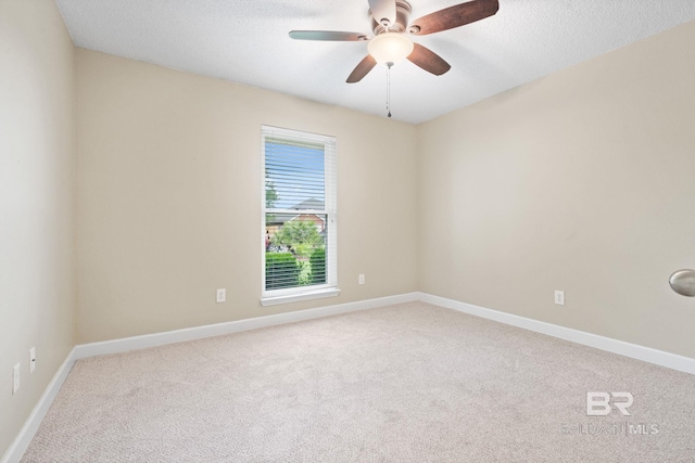 25391 Monarch Ct, Loxley, AL 36551 - spare room featuring carpet flooring, a ceiling fan, baseboards, and a textured ceiling