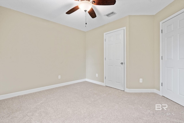 25391 Monarch Ct, Loxley, AL 36551 - unfurnished bedroom featuring light colored carpet, baseboards, and a ceiling fan