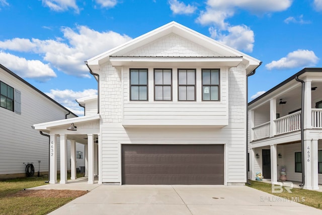 4632 Casablanca Dr, Orange Beach, AL 36561 - view of front of home with an attached garage, driveway, and a balcony