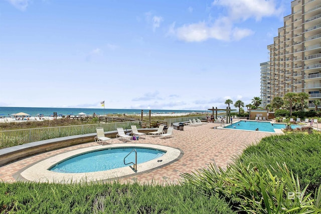 24900 Perdido Beach Blvd Unit 1506, Orange Beach, AL 36561 - view of swimming pool featuring a water view and a patio area