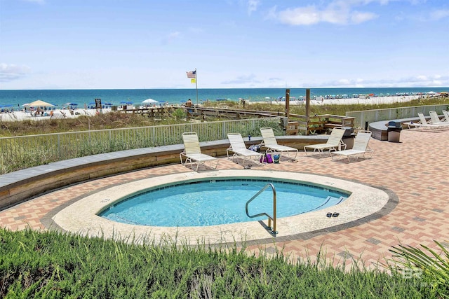 24900 Perdido Beach Blvd Unit 1506, Orange Beach, AL 36561 - view of swimming pool with a patio area and a water view