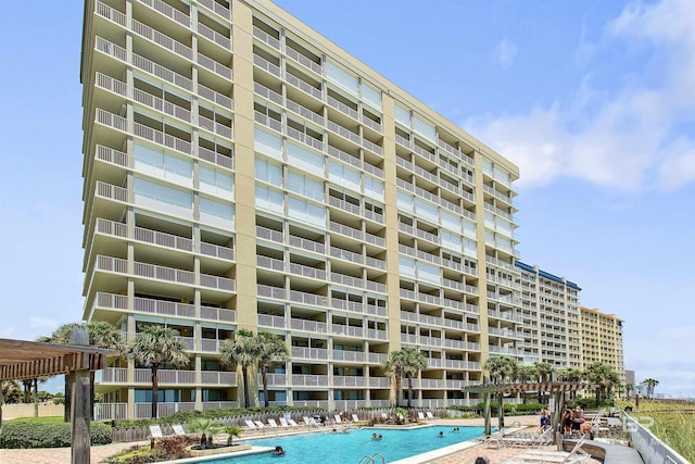 24900 Perdido Beach Blvd Unit 1506, Orange Beach, AL 36561 - view of building exterior featuring a community pool