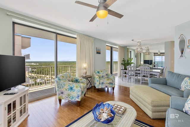 24900 Perdido Beach Blvd Unit 1506, Orange Beach, AL 36561 - living room featuring ceiling fan, a wealth of natural light, and hardwood / wood-style floors