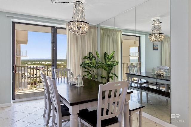 24900 Perdido Beach Blvd Unit 1506, Orange Beach, AL 36561 - dining area featuring light tile patterned floors, expansive windows, and a notable chandelier
