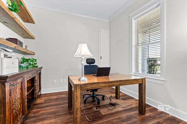 home office with dark wood-style flooring, ornamental molding, and baseboards