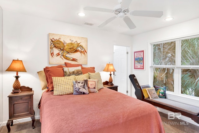 carpeted bedroom with a ceiling fan, recessed lighting, visible vents, and baseboards