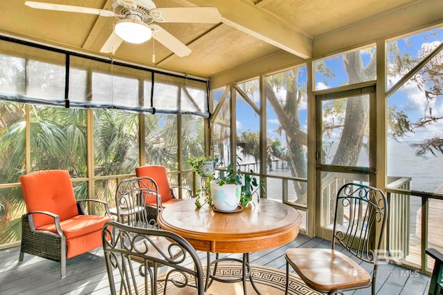 sunroom featuring a ceiling fan