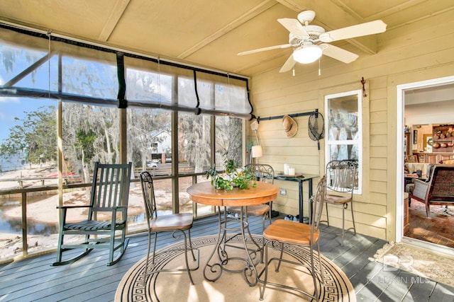 sunroom / solarium featuring a wealth of natural light and ceiling fan