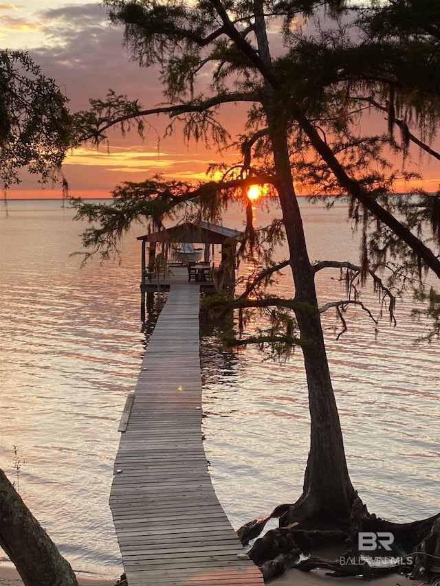 dock area with a water view and boat lift