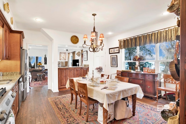 dining area with dark wood-type flooring, plenty of natural light, and recessed lighting