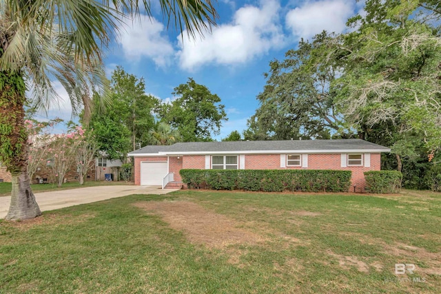 ranch-style home featuring a garage and a front lawn