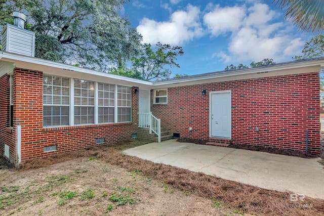 back of property featuring a patio