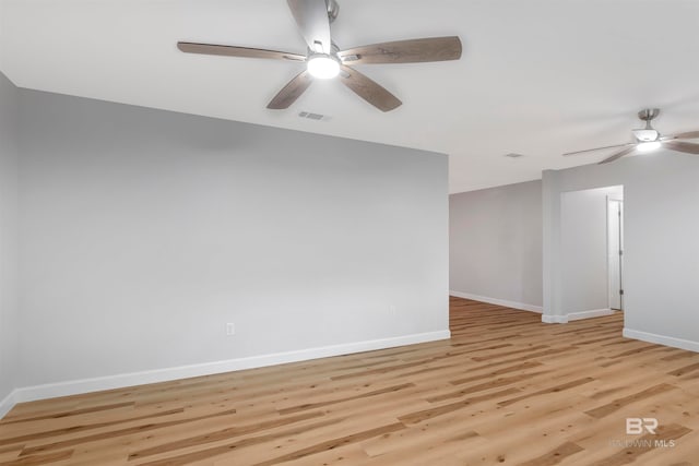 unfurnished room featuring ceiling fan and light wood-type flooring